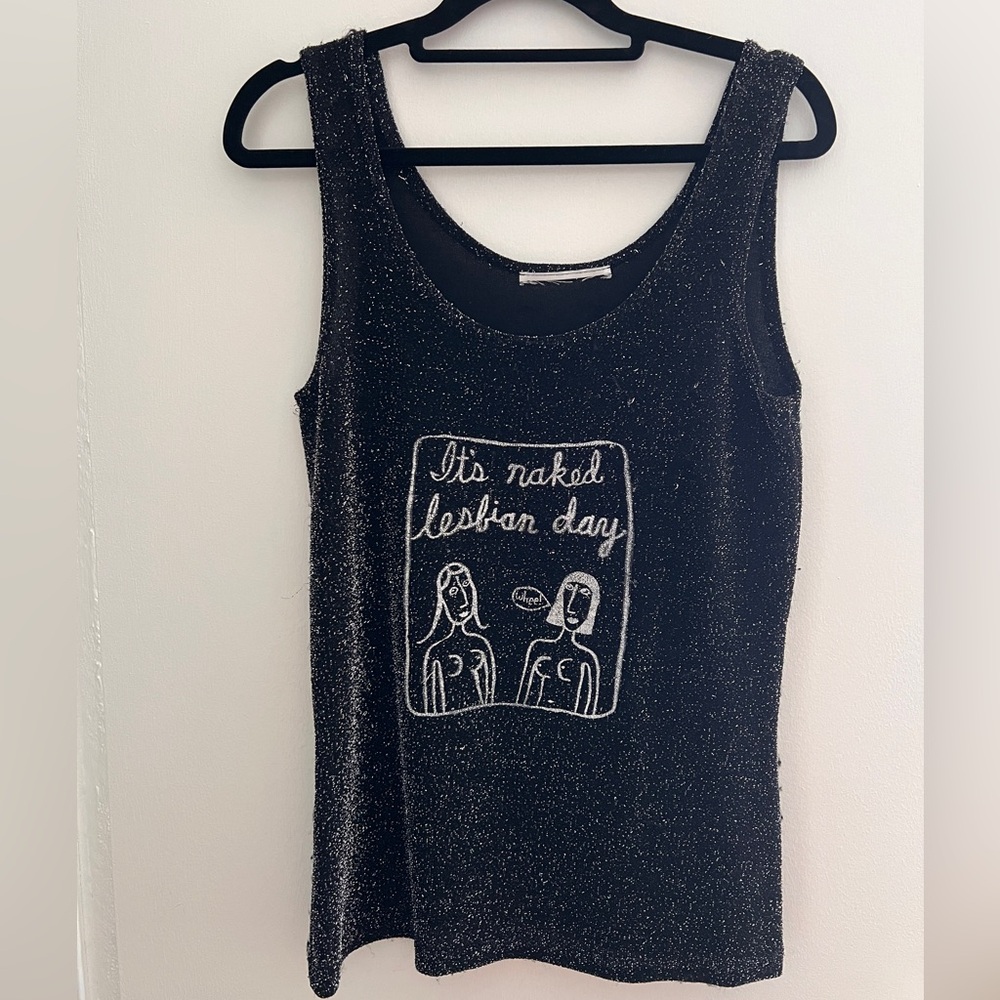 It’s a Naked Lesbian Day hand painted black tank top with metallic thread